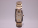 Front angled view of a Seiko Vivace two-tone rectangular ladies watch with a cream dial and gold-tone roman numerals.