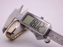 Digital caliper measuring the case size of the Seiko Vivace watch, displaying '18.02 mm'.
