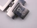 Close-up of the deployant clasp on the D&G Time watch bracelet, engraved with the D&G logo.