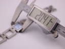 Digital caliper measuring the case diameter of the D&G watch, displaying 20.4 mm.