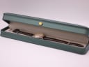 The Tissot PR 50 watch presented inside a generic green leatherette display box with a gold crown emblem.
