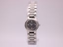 Front view of the Tissot G331K ladies' watch with black dial and integrated silver-tone bracelet.