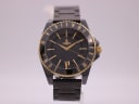 Front view of the Vivienne Westwood VV048GDBK watch with black ceramic case and bracelet, gold-tone bezel and crown.
