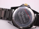 Close-up of the stainless steel caseback showing Vivienne Westwood branding, model number VV048GDBK, and 3ATM water resistance.