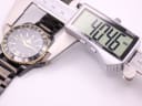 Digital caliper measuring the watch case diameter at 40.746mm.