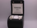 Original Tourneau for Gap Inc. branded green display box with the watch inside, dial slightly blurred.