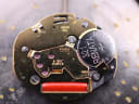 Macro shot of the Ronda Swiss quartz movement, showing 6 jewels and a Renata battery.