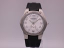 Front view of the Tourneau Gap Inc. watch, showcasing the silver dial, bold numerals, brushed steel case, and black leather strap.