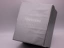 Original grey cardboard outer box with 'Tourneau for Gap Inc.' branding printed on the lid.