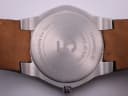 Detailed close-up of the watch's case back, engraved with 'Exclusively for Gap Inc.' and '5 Years of Service by Tourneau'.