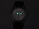 Lume shot of the watch dial in darkness, demonstrating the glowing hour markers and hands.