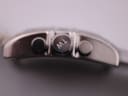 Close-up of the polished crown with engraved 'TW' logo and chronograph pushers.