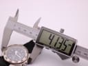 Digital caliper measuring the case diameter of the Police watch, showing a precise reading of 41.35mm.
