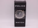 The Police watch displayed upright in its original black cardboard 'POLICE WATCH' retail box with a transparent window.