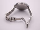 Underneath view of the Michael Kors watch bracelet with the fold-over clasp open.