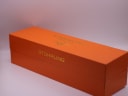 Exterior view of the orange Stührling Original original presentation box with gold logo on top.