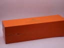 Another exterior view of the orange Stührling Original original presentation box, showing a slight crease on the side.