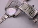 Side view of the Stührling Original watch being measured by a digital caliper, displaying 37.70 mm for the case diameter.