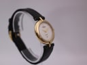 Side view of Raymond Weil 5350 watch on display stand, showcasing the gold case profile and crown.