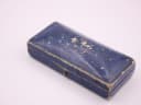 Exterior shot of the closed original vintage blue F. Hinds Ltd. presentation box, showing its aged textured surface.