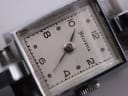 Extreme close-up on the Helvetia cream dial, showing the intricate details of the Arabic numerals, dot hour markers, and the 'Helvetia' brand name.