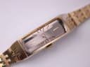Close-up top-down view of the Seiko watch dial and fluted crown, emphasising the vertical brushed texture.