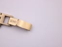 Close-up of the gold tone steel bracelet clasp, clearly showing the 'SEIKO' signed engraving.