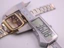 Digital caliper measuring the case diameter of the Seiko watch, displaying an exact measurement of 38.00 mm.
