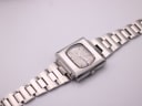 Overhead view of vintage Seiko 6119-5401 with flat integrated steel bracelet extended.