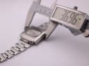Digital caliper measuring the case width of the Seiko 6119-5401, displaying 36.96mm.