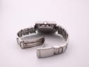 Side view of the Seiko 6119-5401 with its steel bracelet and deployed clasp.