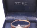 Close-up of the interior of the original blue Seiko box, showing the 'SEIKO' logo and worn fabric.