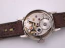 Movement shot of the Seiko 21A 17 jewels manual wind calibre inside the opened case.