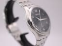 Opposite angled side view highlighting the curved lugs and stainless steel bracelet.