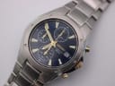 Close-up of the Seiko blue chronograph dial, detailing the sub-dials, gold baton indices, and hands.