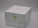 Angled view of the original white Seiko presentation box, showing a sticker on the side.