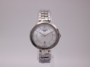 Front view of the Tissot T094210 A ladies' watch with a white mother-of-pearl dial and stainless steel bracelet.
