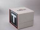 Top and side view of the closed original Tissot branded red and white presentation box.