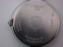 Close-up of the brushed stainless steel case back with Tissot 1853 logo, "SAPPHIRE CRYSTAL", "WATER-RESISTANT 5bar (50m/165ft)", and model "T094210 A" engravings.