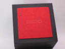 Top view of the closed generic black display box with a red textured lid, showing the word 'SEIKO' embossed on it.