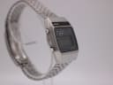 Angled side view of the Seiko A159-5009-G watch, showing the smooth case profile on the left side and bracelet links.