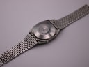 Rear view of the Seiko A159-5009-G watch, showing the stainless steel case back and the multi-link bracelet.