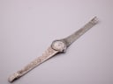 Overhead view of the Jesty watch, showing its full length and textured sterling silver bracelet.