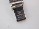Close-up of the bracelet clasp, displaying a '925' sterling silver hallmark and a maker's mark.