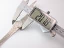 Digital caliper measuring the watch case, showing a precise diameter of '20.78mm'.
