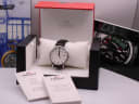 Tissot T063610 A watch in its original red and black Tissot presentation box with user manuals and warranty cards.