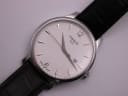 Close-up of the white dial with the Tissot logo, date window, and "Swiss Made" text at the 6 o'clock position.