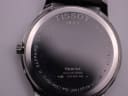 Detailed close-up of the stainless steel case back, displaying Tissot branding, model T063610 A, serial number, "Sapphire Crystal", and "Water-Resistant 3bar (30m/100ft)" engravings.