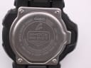 Close-up of the stainless steel case back of the Casio G-Shock GDF-100, showing "GDF-100", "WATER RESIST 20BAR", and "SHOCK RESIST" engravings.