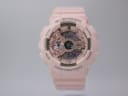 Front view of the pink G-SHOCK GMA-S110MP watch with rose gold accents on a light background.